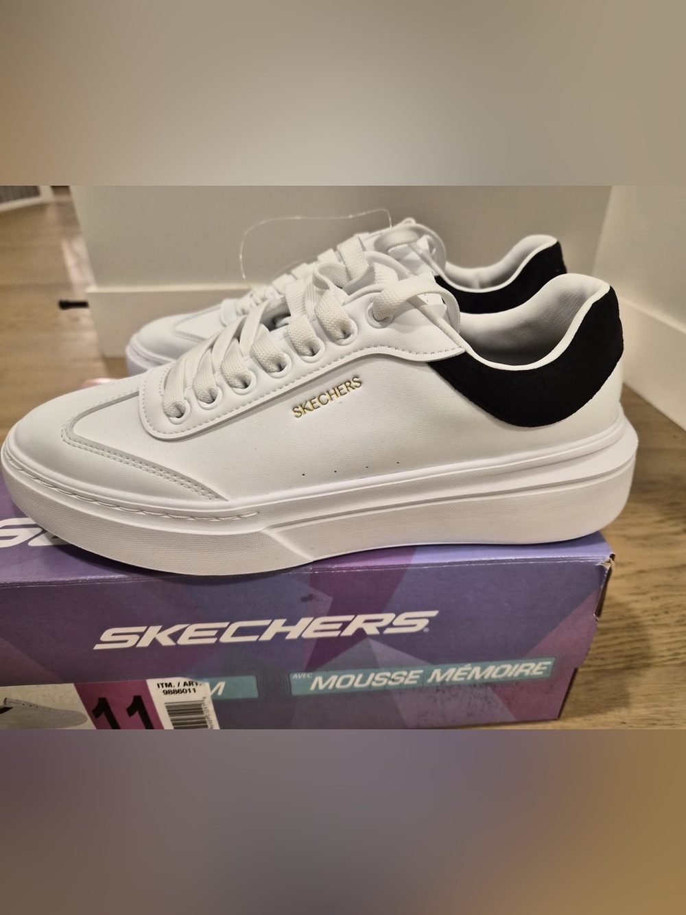 Skechers White Sneakers with Black Heel Accent